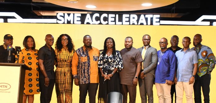 Hon. George Opare Addo, Minister for Youth Development and Empowerment, with Executives of MTN Ghana.