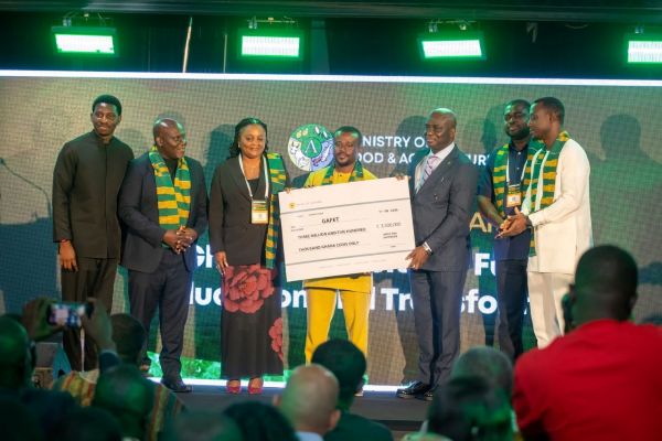7. The founding funders of GAFET presenting a cheque to the minister of Agriculture with Steven Odarteifio, Lead Cordinator